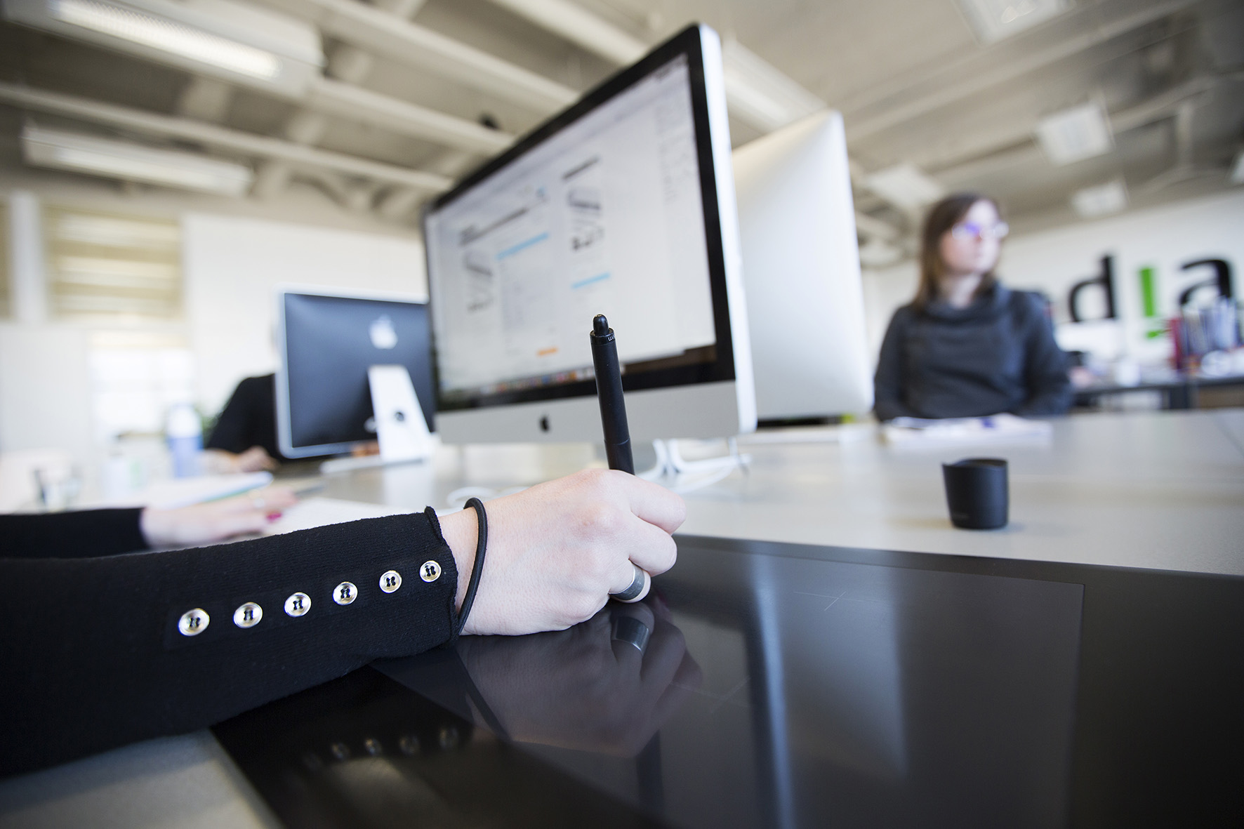 A colleague working on a trackpad